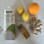 organic Coconut water carton, a fresh orange unpeeled, 2 lemons unpeeled, ginger root, turmeric organic powder